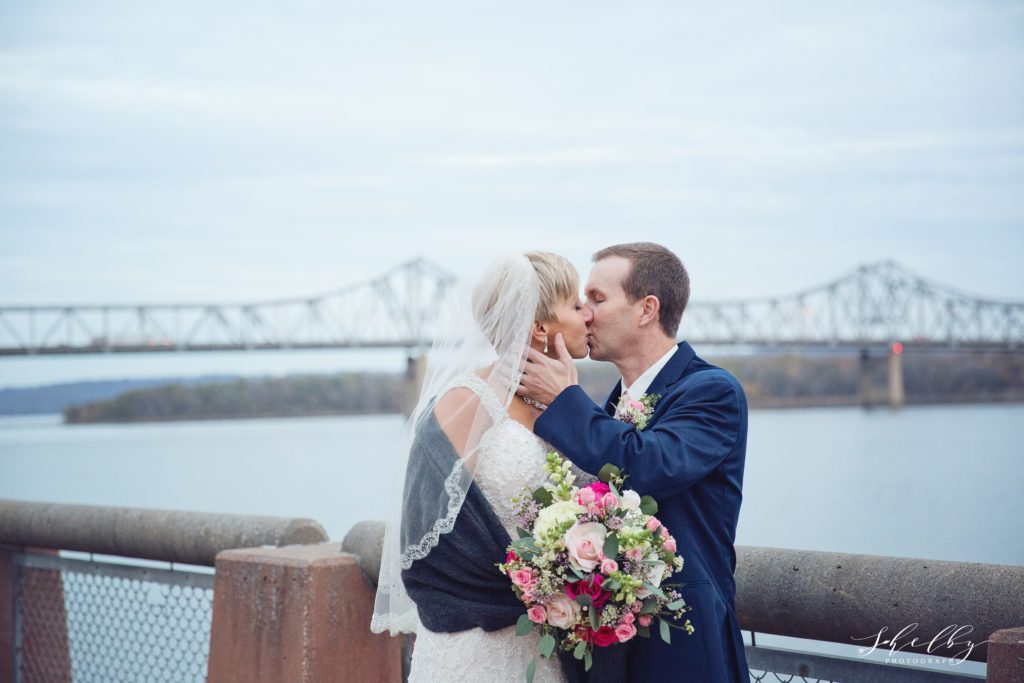 bride and groom in downtown Peoria by riverfront