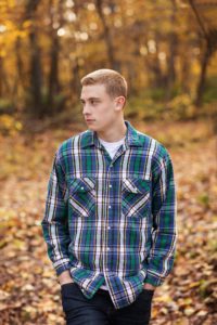 senior picture with plaid flannel